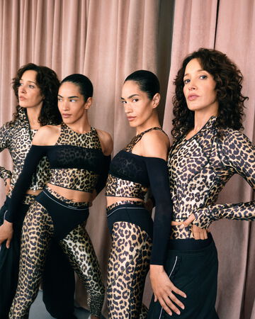 Models wearing ECRIN x Lululemon leopard tops